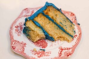 A wedding cake on a plate.