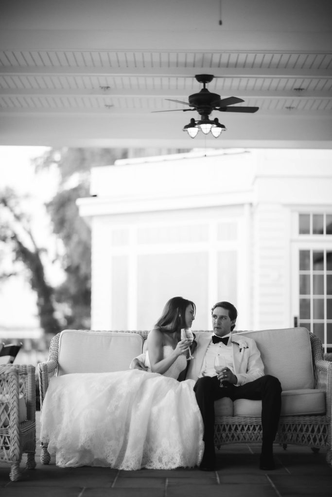 A bride and groom posing for a portrait at their wedding.