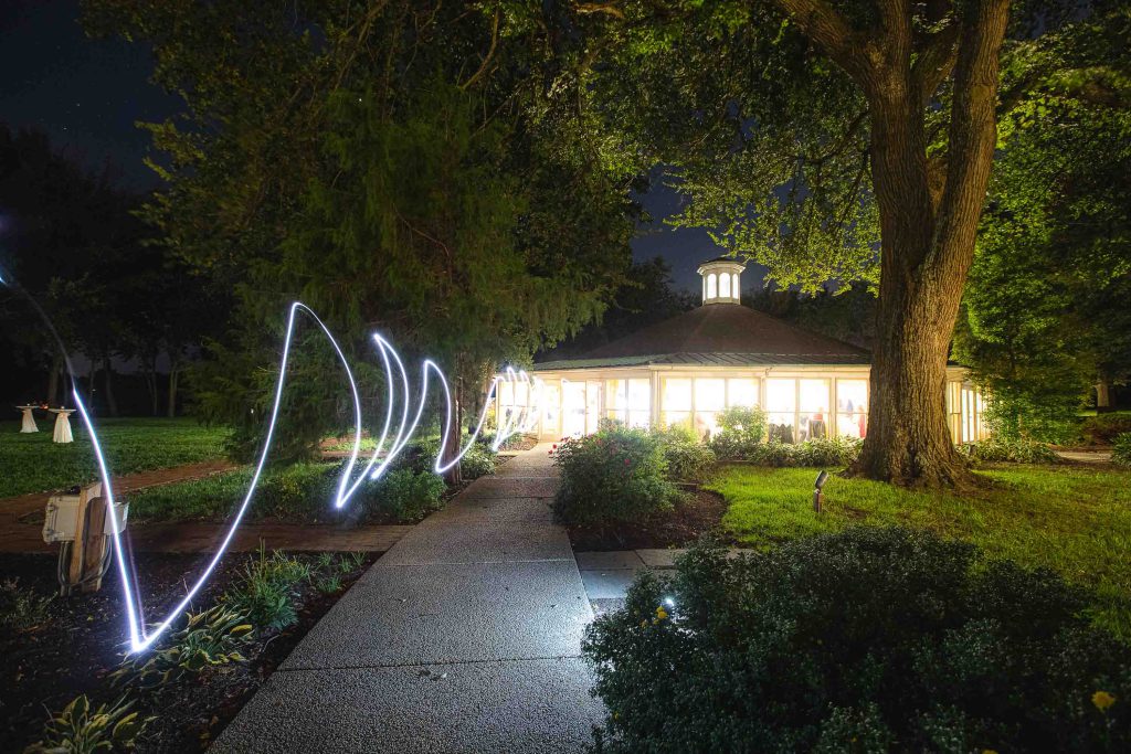 A detailed light painting of a gazebo at night, perfect for weddings.