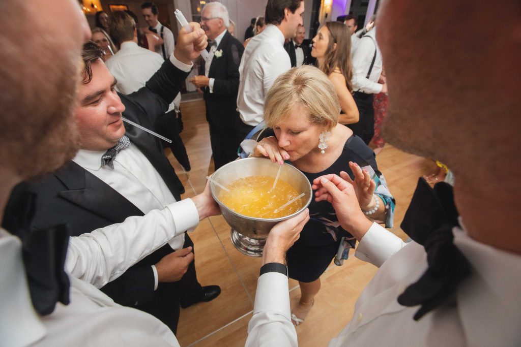 A group of people celebrating at a wedding reception.