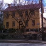 Roostervane Gardens, a yellow house.