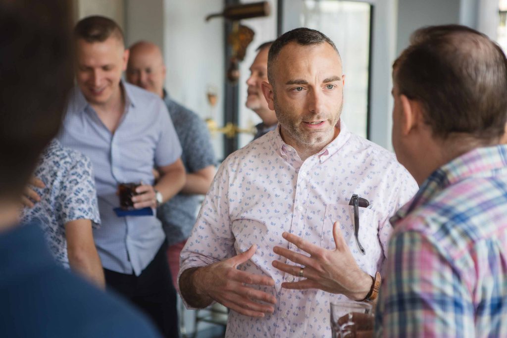 A group of people conversing and networking at a social event.