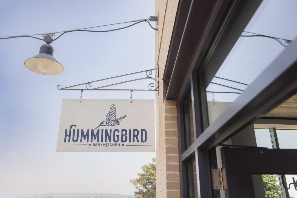 A Birthday Party at a building with a sign that says hummingbird.