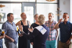 A group of people celebrating a birthday at a bar.