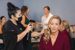 A candid bride preparing for her wedding.