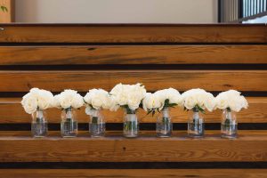White flowers on wooden stairs.