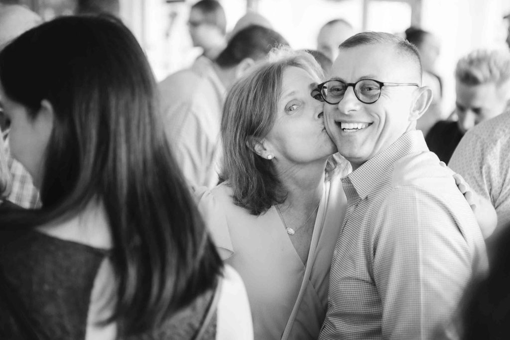 A black and white photo of a couple at a birthday party.