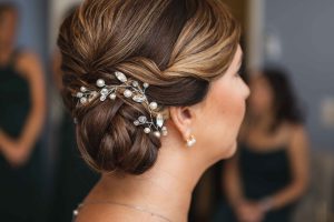 A bride with pearl details in her hair on her wedding day.