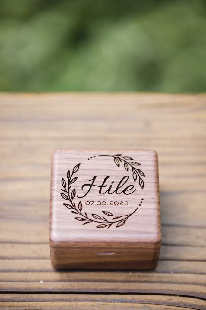 A personalized wedding detail featuring a wooden box with the word hello on it.