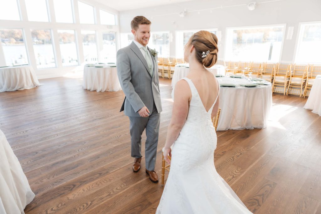 A candid bride and groom sharing a tender moment during wedding preparation.