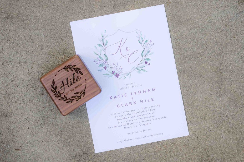 A wedding invitation with rubber stamp details.