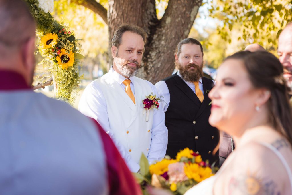 A couple gazes at each other during their wedding ceremony.