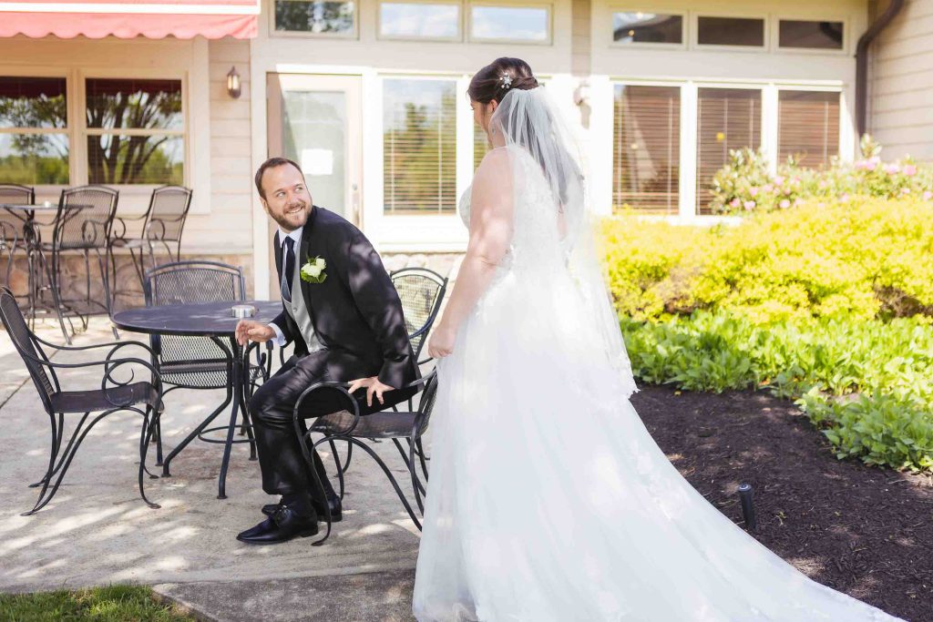 A candid bride and groom during wedding preparation.