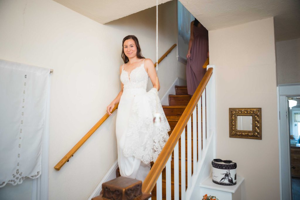 A candid bride preparing for her wedding.