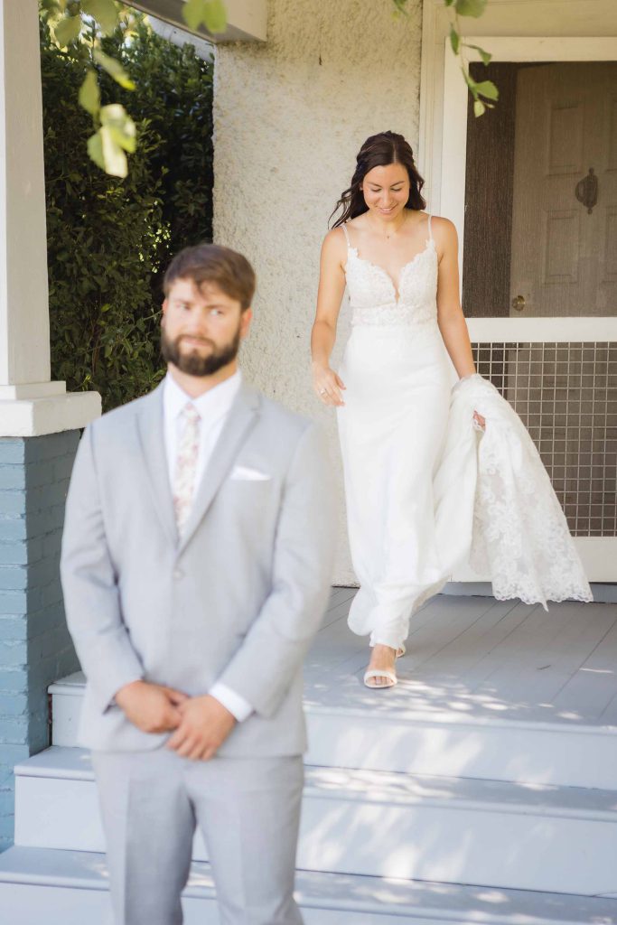 A candid shot of the bride and groom during their wedding preparations.