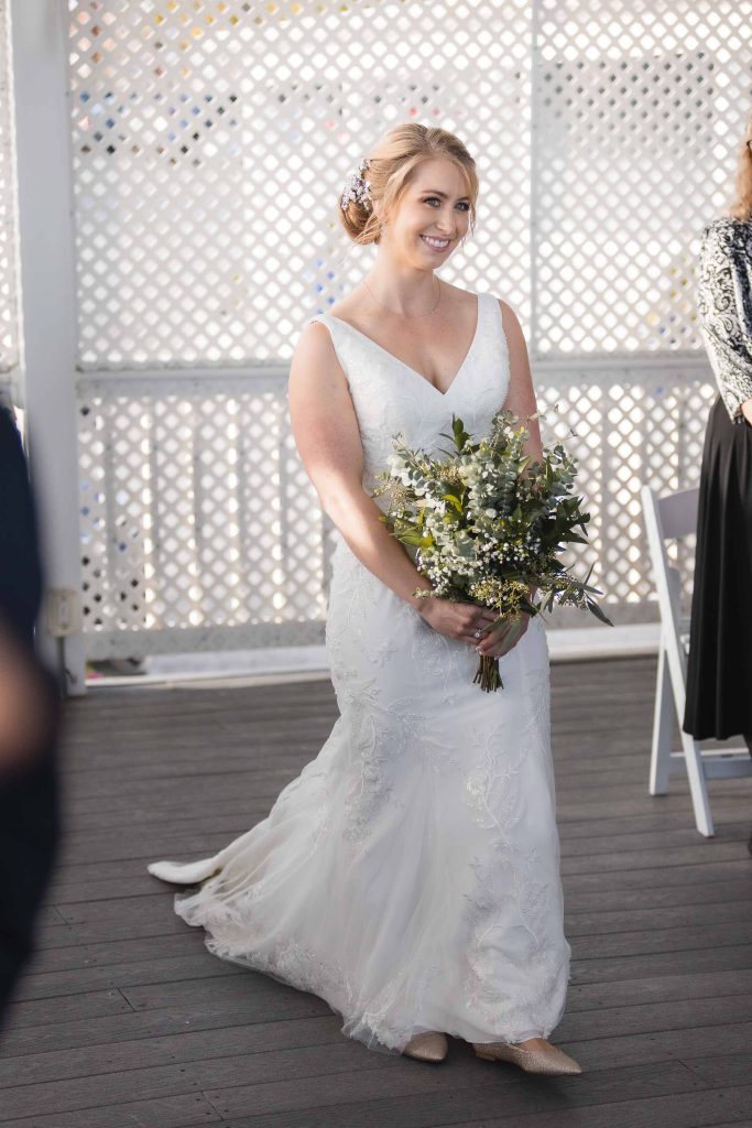 A bride walking down the aisle during a wedding ceremony.
