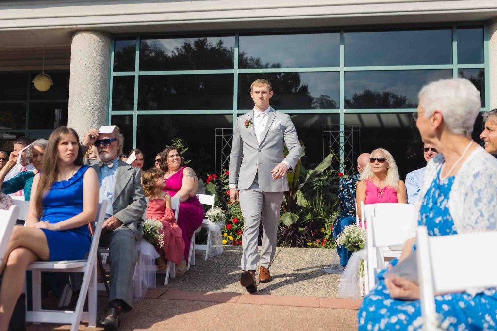 A man participating in a wedding ceremony.