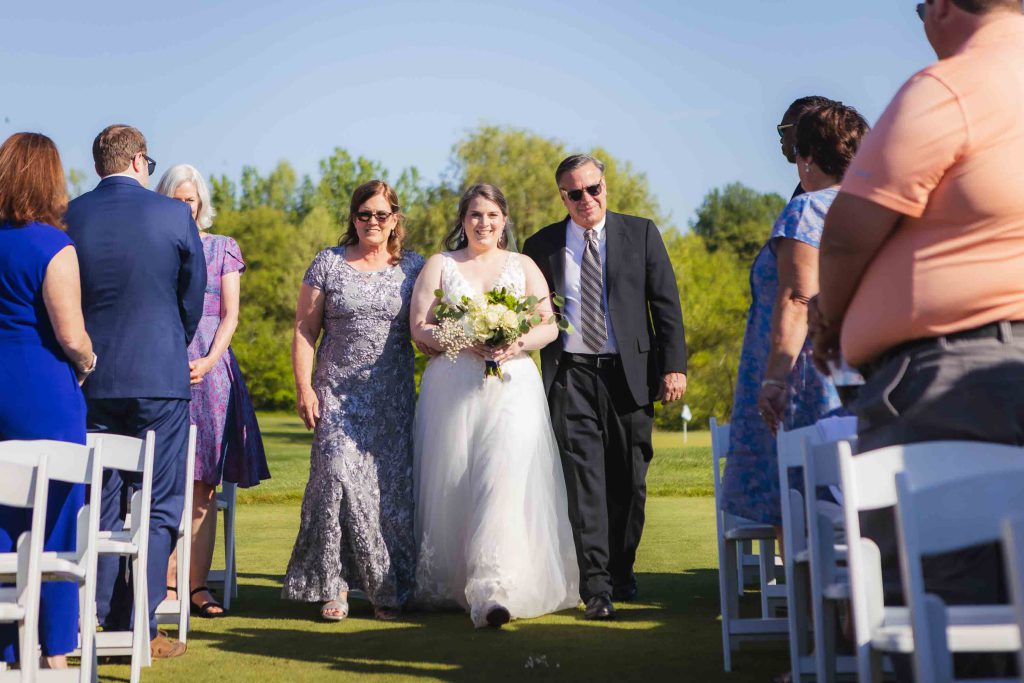 A wedding ceremony at a golf course.