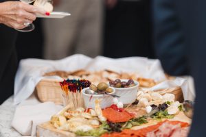 A person holding a glass of wine at a wedding.