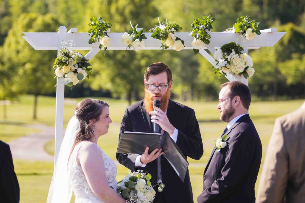 A couple exchanging vows at their wedding ceremony.