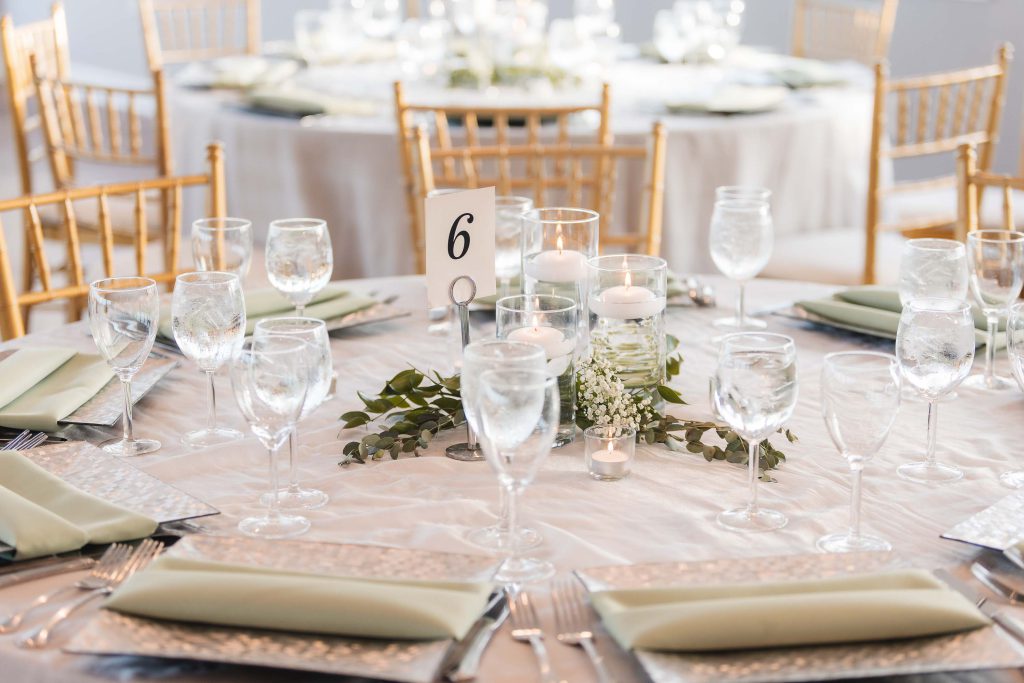 A table beautifully set with wedding details.