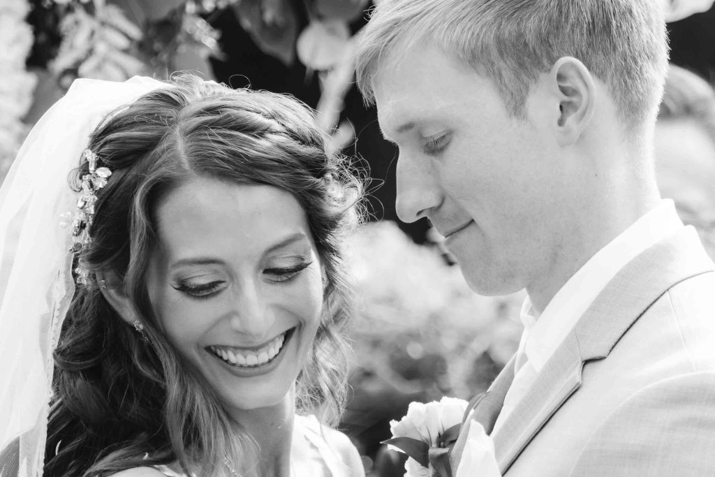 A black and white photo of a wedding ceremony.