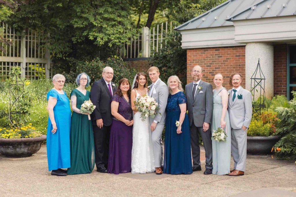 A wedding party poses for a portrait.