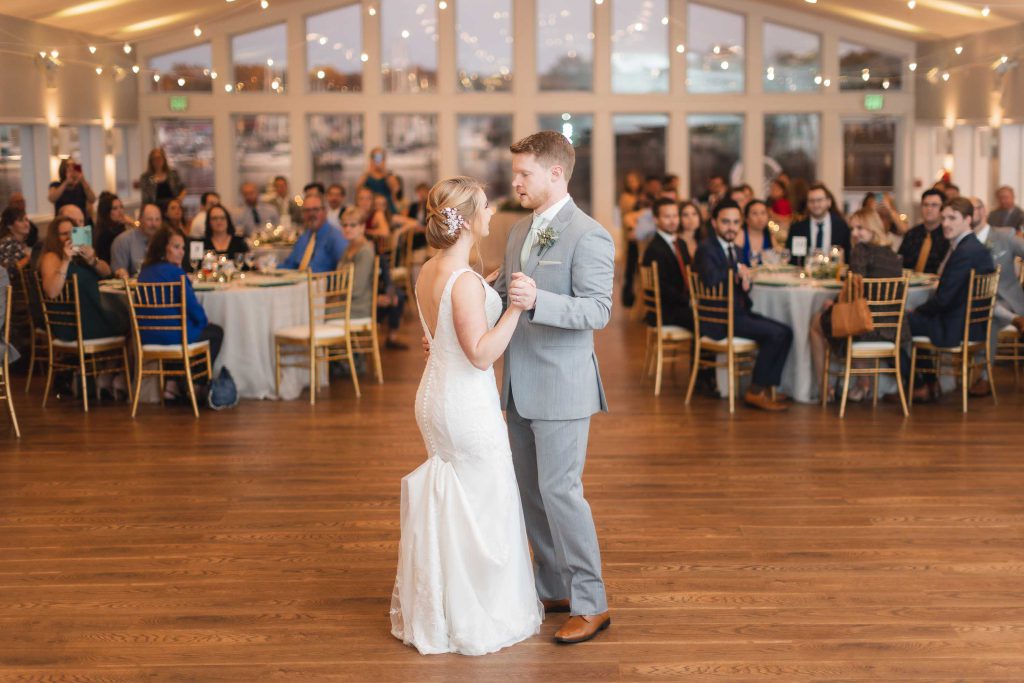 A couple sharing their first dance at their wedding reception.