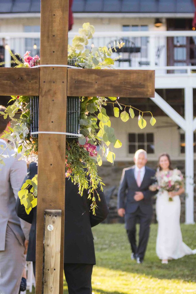 A wooden cross at a wedding ceremony.