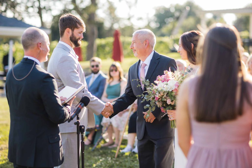 A bride and groom exchange vows during a wedding ceremony.