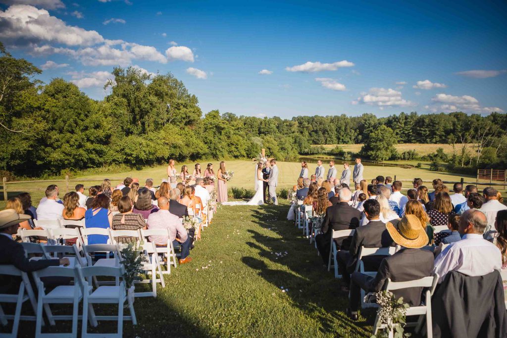 A ceremony in a field for a wedding.