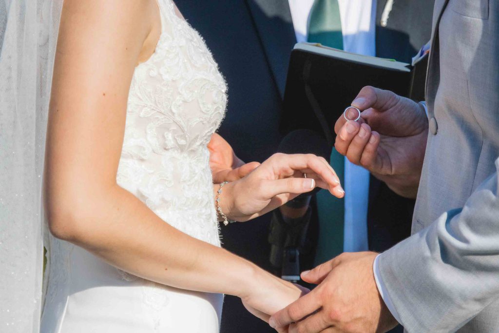 A couple participates in a wedding ceremony.
