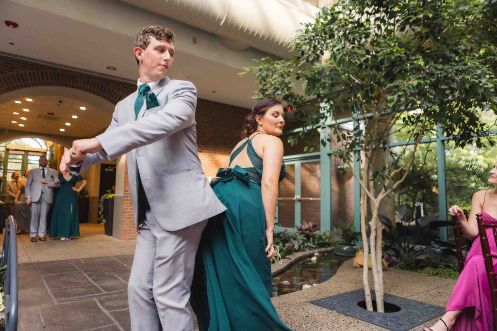 A bride and groom dancing at their wedding reception.