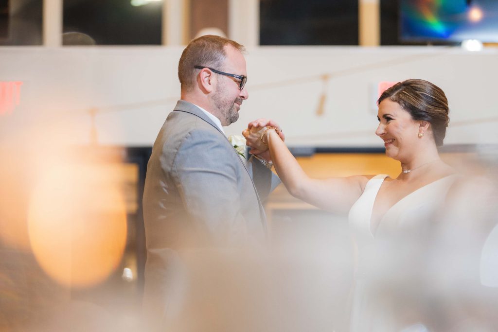 A couple sharing their first dance at a wedding reception.