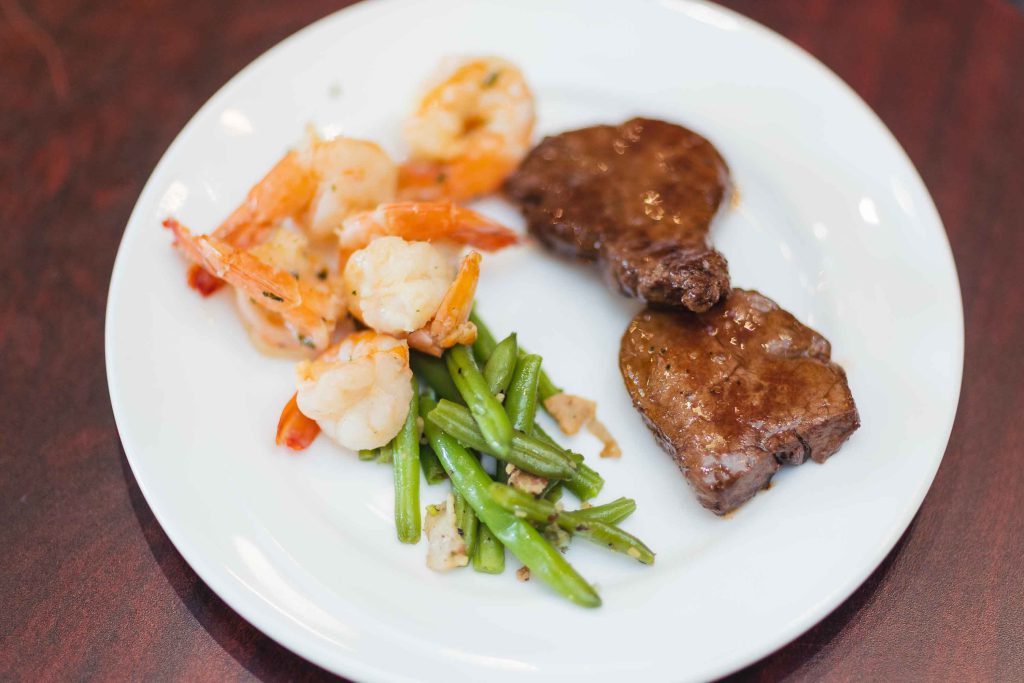 Wedding details: Steak, shrimp, and green beans elegantly plated.