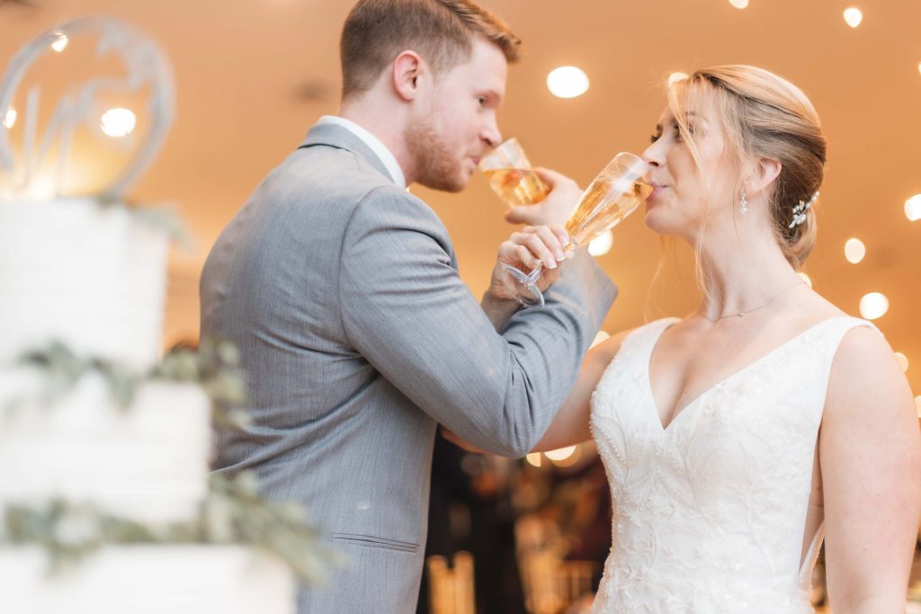 A couple toasting at their wedding reception.