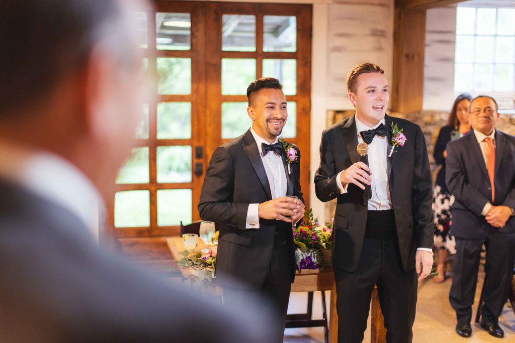 Two grooms at a wedding ceremony.
