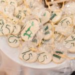 A table full of cookies with numbers on them for a Birthday Party.