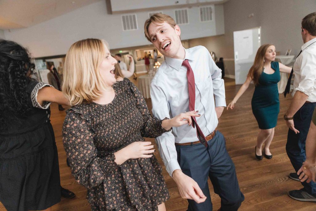 A group dancing at a wedding reception.