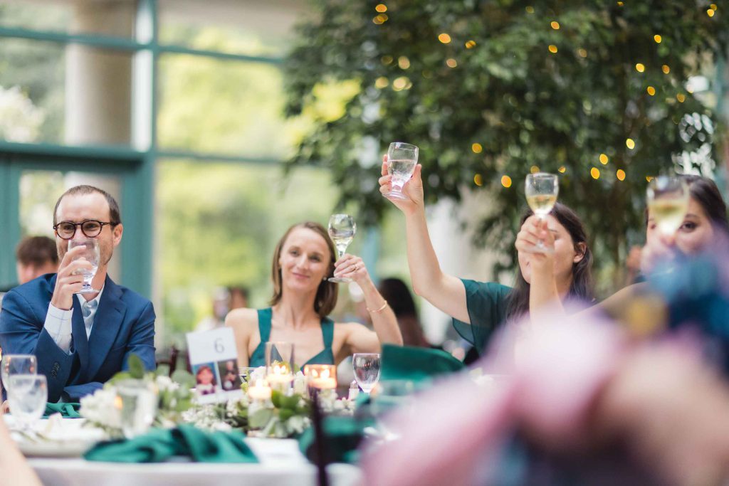 A group celebrating at a wedding reception.