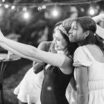 A group of girls taking a selfie at a quinceañera party.