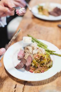A wedding feast with intricate details displayed on a table.
