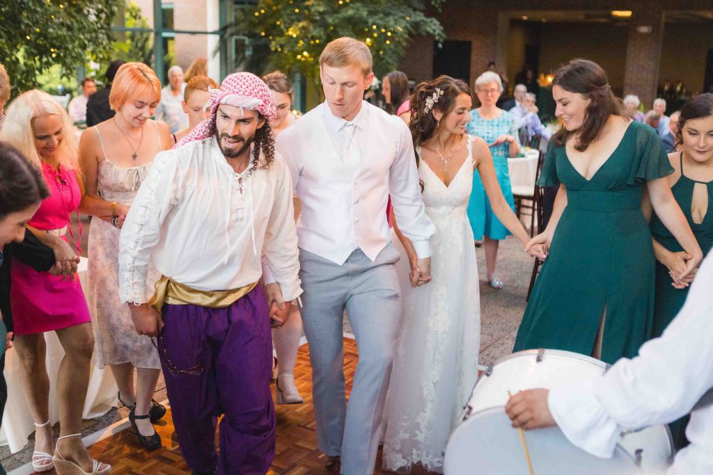 A couple walks down the aisle at their wedding.