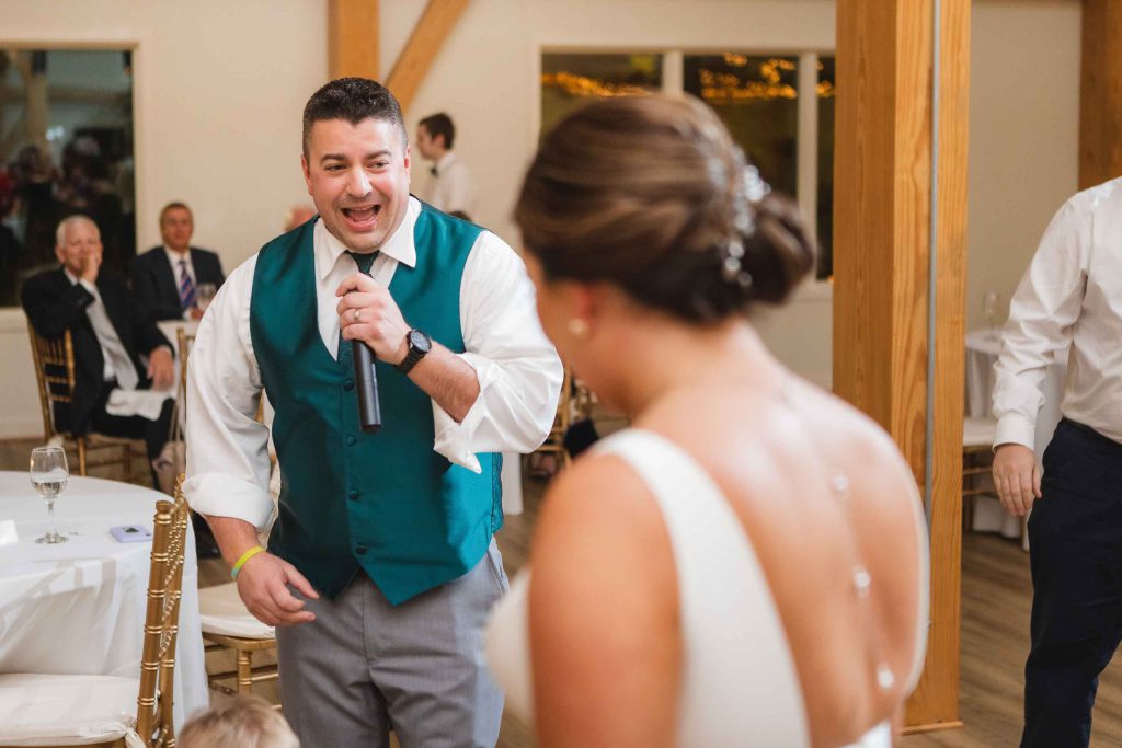 A couple singing at their wedding reception.