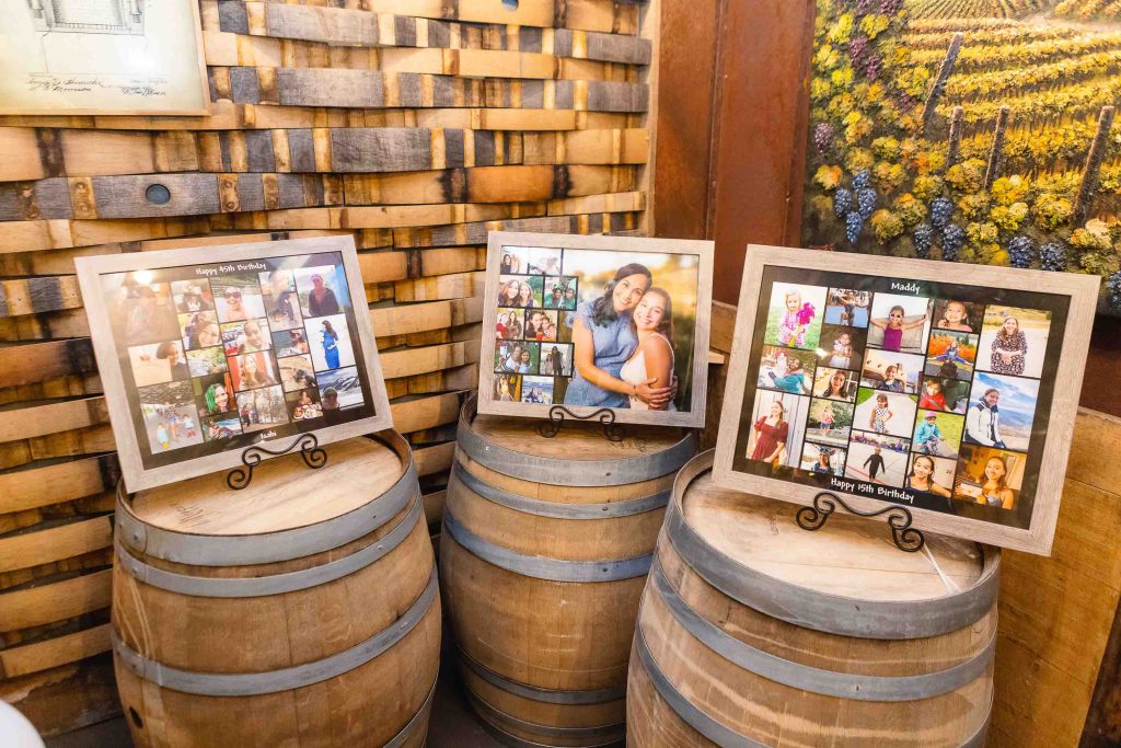 Three wine barrels decorated for a quinceañera.