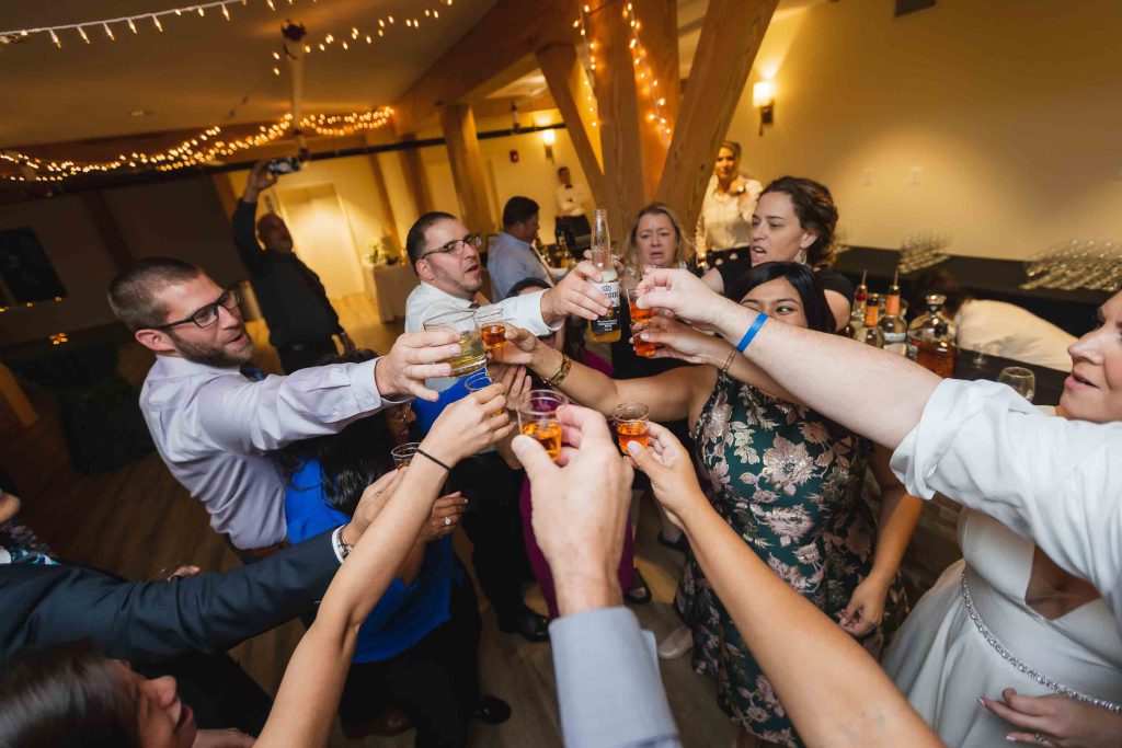 A wedding reception celebration with toasting.