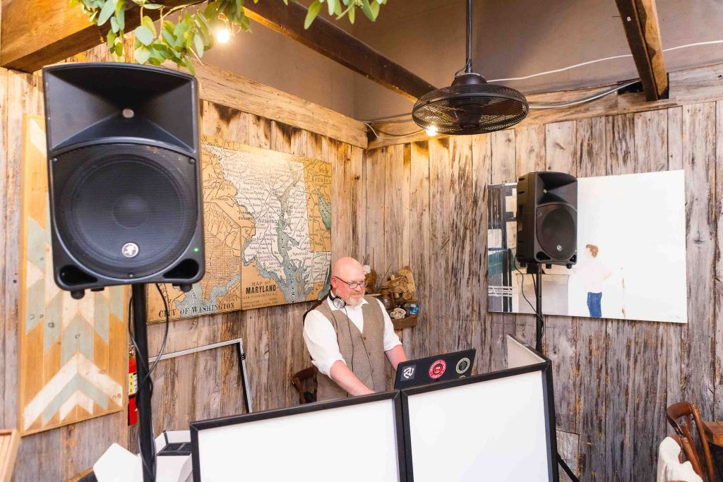 A man DJing at a quinceañera.