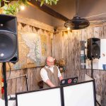A man DJing at a quinceañera.