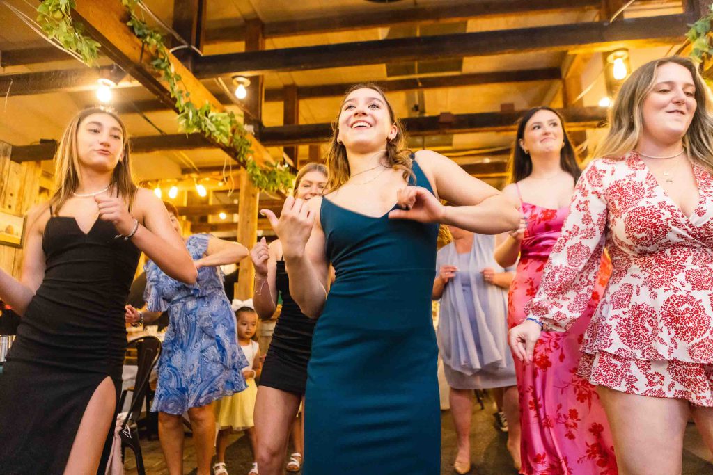 A group of women dancing at a quinceanera party.