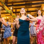 A group of women dancing at a quinceanera party.